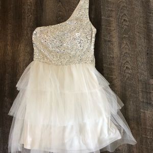 Short white homecoming dress with one strap.
